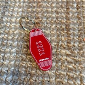 Red Nashville 1221 Keychain "Heated Rivalry"